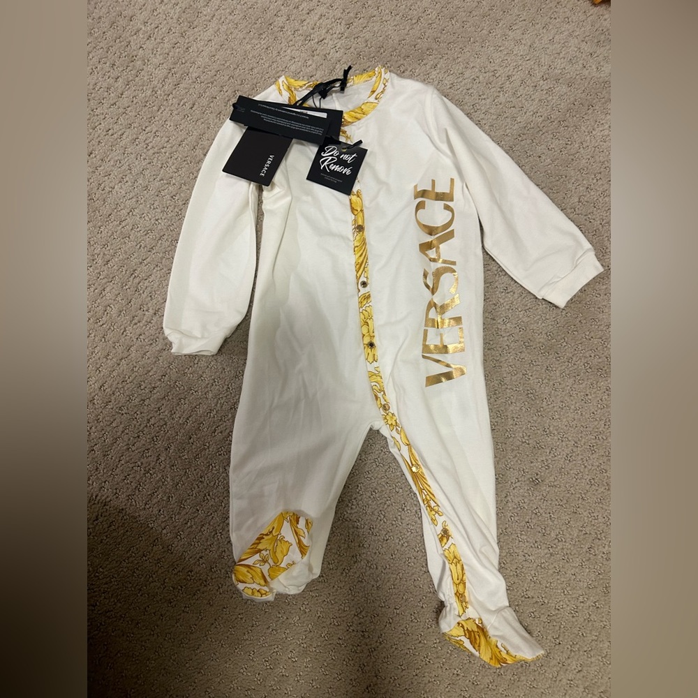 Versace baby one piece (9-12 m) new with tags
